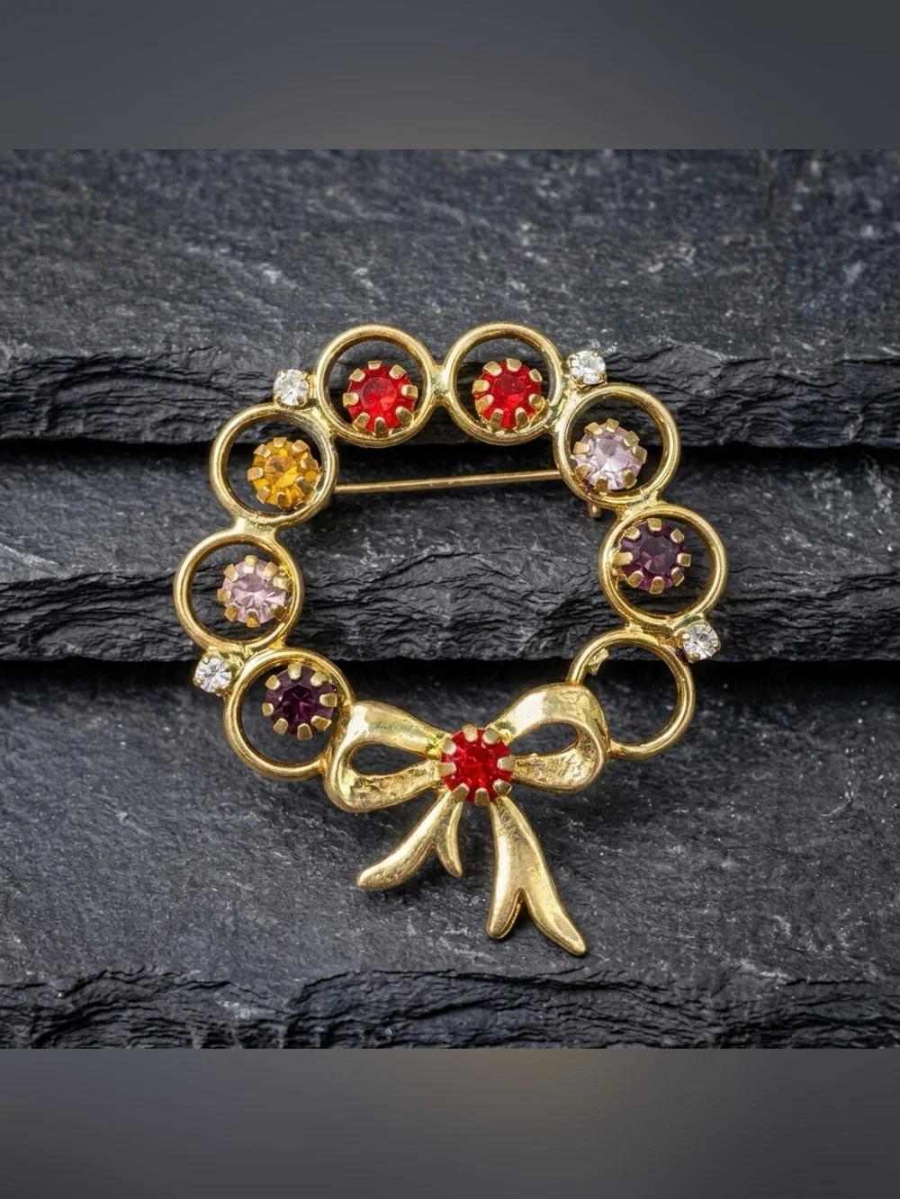 Vintage 60s Multicolor Rhinestone Open Circle Ring Ribbon Bow Gold Tone Brooch